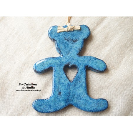 Grand ourson turquoise foncé en poterie Grand ourson turquoise foncé en poterie