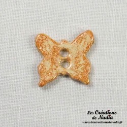 Bouton papillon vanille en céramique