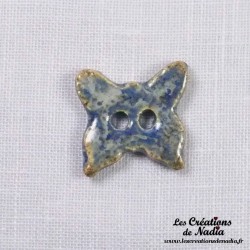 Bouton papillon bleu-gris marbré en céramique
