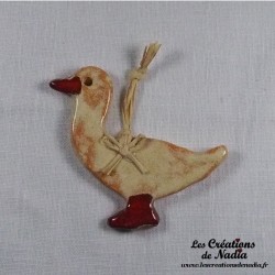 Petit canard en céramique, couleur vanille, à suspendre