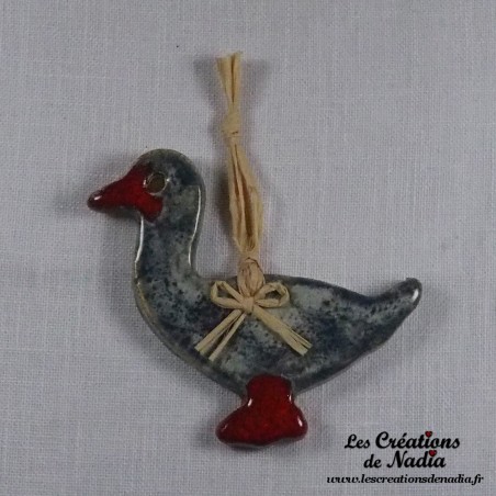 Petit canard en céramique, couleur bleu-gris marbré, à suspendre