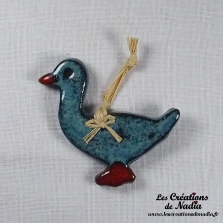 Petit canard en céramique, couleur turquoise foncé, à suspendre