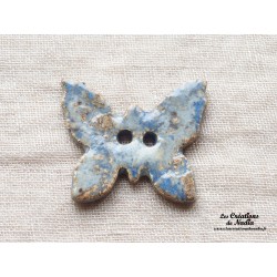 Bouton papillon couleur bleu-gris marbré en céramique