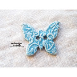Bouton papillon couleur bleu lagon en céramique