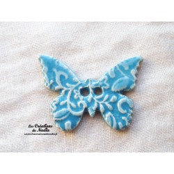 Bouton papillon couleur bleu lagon en céramique