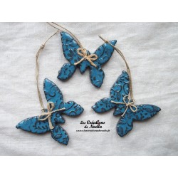 Papillon en céramique, couleur bleu canard impressions fines dentelles