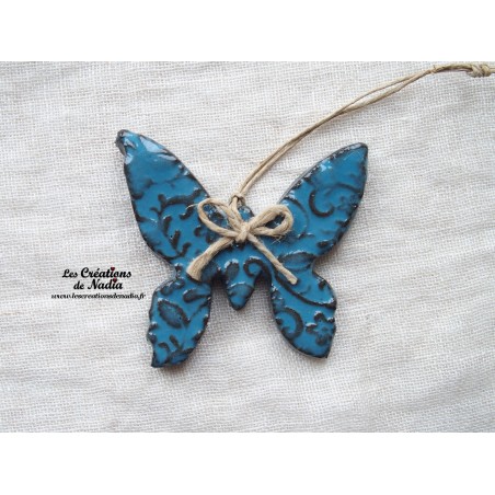 Papillon en céramique, couleur bleu canard impressions fines dentelles