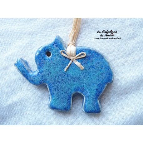 Petit éléphant couleur bleu turquoise en céramique
