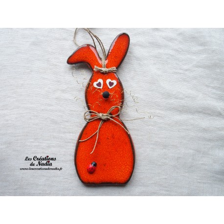 Lapin en céramique couleur orange, à suspendre