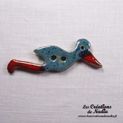Bouton cigogne en vol bleu en céramique
