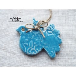 Colombe en céramique, couleur bleu lagon impression fines dentelles