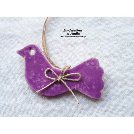 Oiseau en céramique, couleur lilas impressions florales Oiseau en céramique, couleur lilas impressions florales