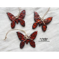 Papillon en céramique, couleur bicolore orange et noir, impressions fines dentelles