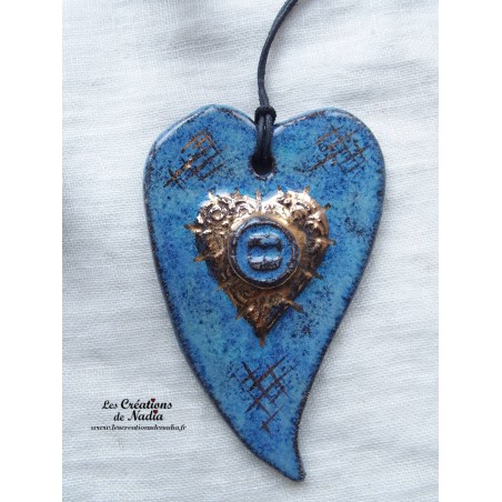 Coeur allongé en céramique en or et bleu