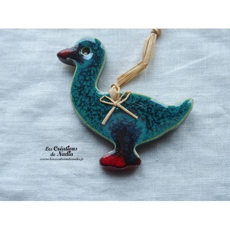 Petit canard en céramique, couleur vert bouteille, à suspendre