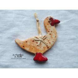 Petit canard en céramique, couleur pain d'épice, à suspendre