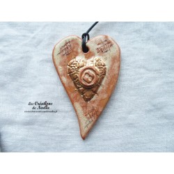 Coeur allongé en céramique couleur or et vanille, à suspendre