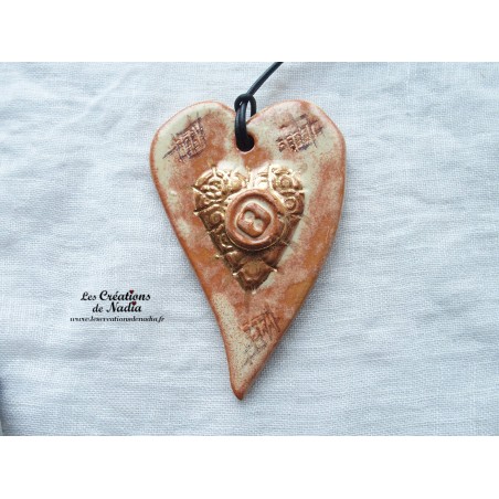 Coeur allongé en céramique couleur or et vanille, à suspendre